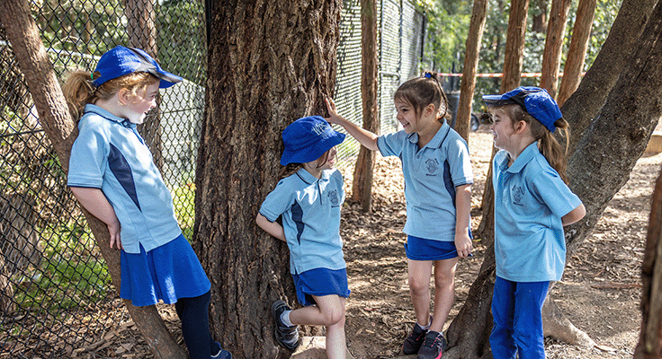 Girls talking amongst trees
